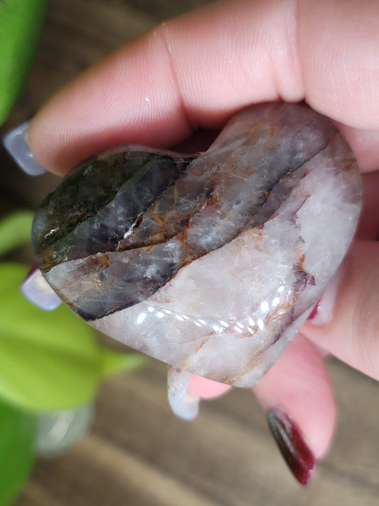 fire quartz puffy heart carving in hand